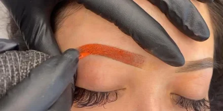 Reference image of a girl having her eyebrows color corrected.
