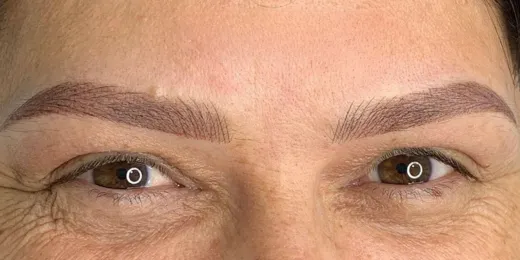 The appearance of a woman's eyebrows after the Combo Brows technique.
