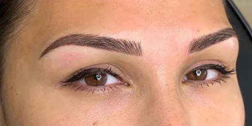 The appearance of a woman's eyebrows after the Combo Brows technique.