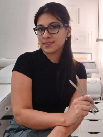 Photo of me sitting in my salon waiting for you to create your new look.